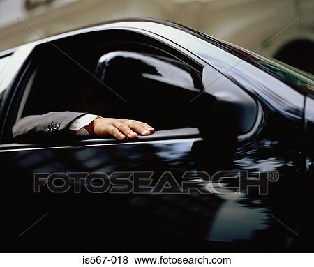 Businessman in a car View Large Photo Image Stock Photo - Businessman in a car. Fotosearch