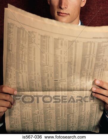 Businessman reading financial newspaper View Large Photo Image Stock Photograph - Businessman reading financial newspaper. Fotosearch