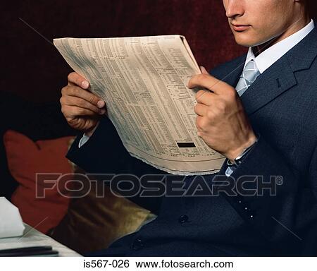 Businessman reading financial paper View Large Photo Image Stock Photograph - Businessman reading financial paper. Fotosearch