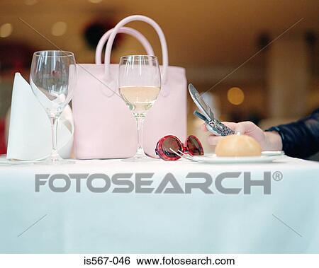 Feminine items on restaurant table View Large Photo Image Stock Photograph - Feminine items on restaurant table. Fotosearch
