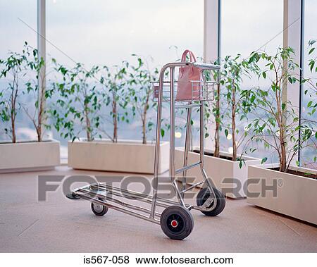 Handbag on luggage trolley View Large Photo Image Stock Photo - Handbag on luggage trolley. Fotosearch