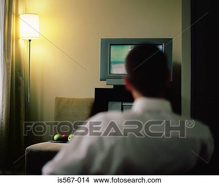Man watching television View Large Photo Image Picture - Man watching television. Fotosearch