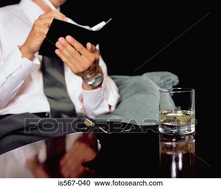 Man writing in personal organiser View Large Photo Image Stock Image - Man writing in personal organiser. Fotosearch