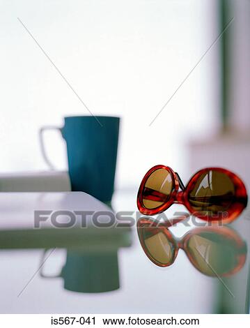 Sunglasses on desk View Large Photo Image Stock Image - Sunglasses on desk. Fotosearch