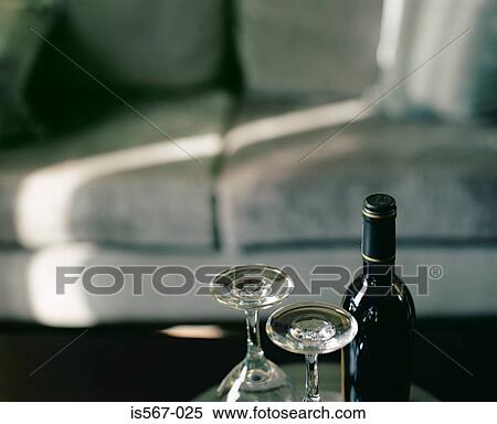 Wine and glasses by a sofa View Large Photo Image Stock Photography - Wine and glasses by a sofa. Fotosearch