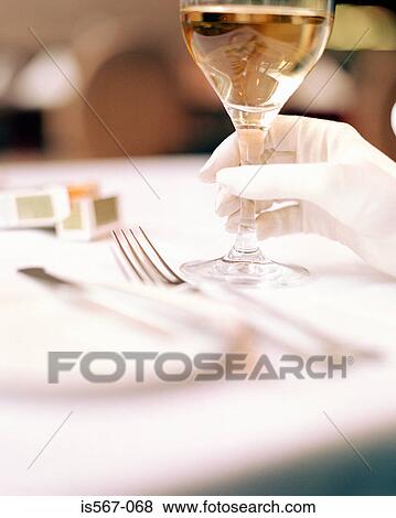 Stock Photo - Woman holding glass of wine. Fotosearch