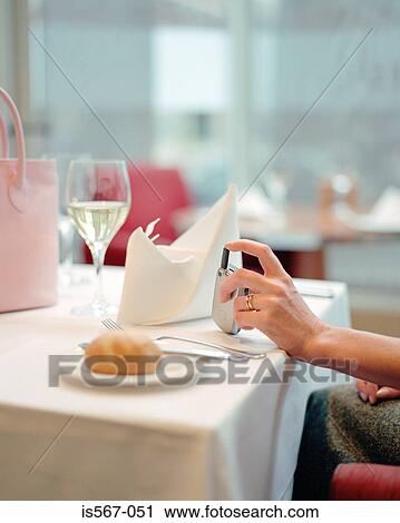 Woman sitting in restaurant View Large Photo Image Stock Image - Woman sitting in restaurant. Fotosearch