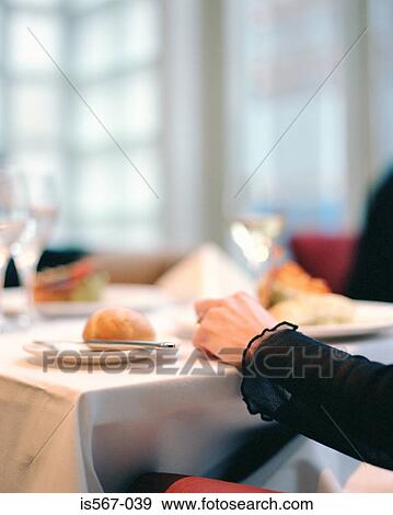 Woman sitting in restaurant View Large Photo Image Stock Photo - Woman sitting in restaurant. Fotosearch
