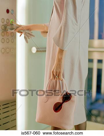 Woman waiting for elevator View Large Photo Image Stock Image - Woman waiting for elevator. Fotosearch