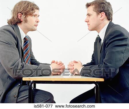 Stock Photo - Businessmen in meeting. Fotosearch