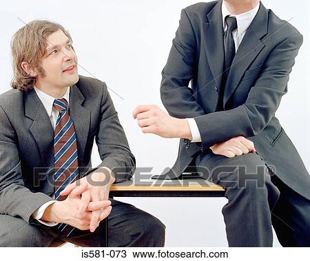 Stock Image - Businessmen talking. Fotosearch