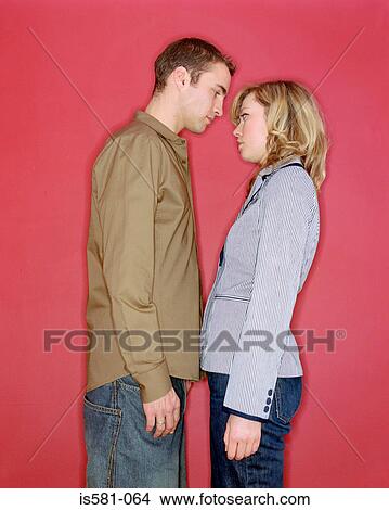 Couple standing face to face View Large Photo Image Picture - Couple standing face to face. Fotosearch