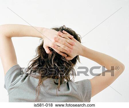 Stock Photo - Woman with hands behind head. Fotosearch