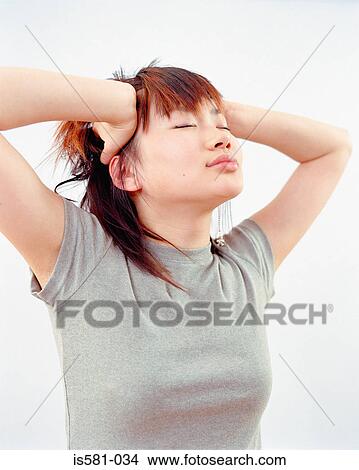 Woman with hands on head View Large Photo Image Picture - Woman with hands on head. Fotosearch