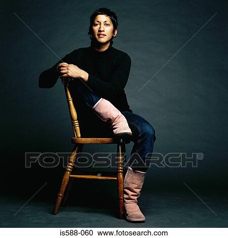 Portrait of woman on a chair View Large Photo Image Stock Image - Portrait of woman on a chair. Fotosearch