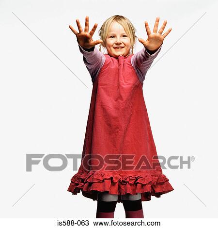 Young girl with hands raised View Large Photo Image Stock Image - Young girl with hands raised. Fotosearch