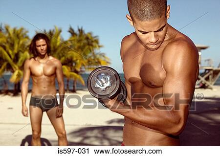 Man exercising on beach View Large Photo Image Stock Image - Man exercising on beach. Fotosearch
