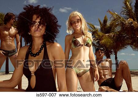 Stock Photo - Stylish people on beach. Fotosearch