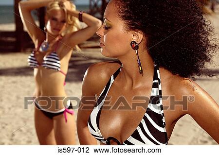 Women posing on beach View Large Photo Image Stock Image - Women posing on beach. Fotosearch