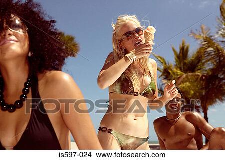 Young people on beach View Large Photo Image Picture - Young people on beach. Fotosearch