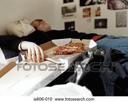 Boy sleeping with pizza on bed View Large Photo Image Stock Image - Boy sleeping with pizza on bed. Fotosearch