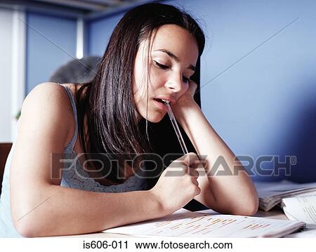 Girl doing homework in bedroom View Large Photo Image Stock Image - Girl doing homework in bedroom. Fotosearch