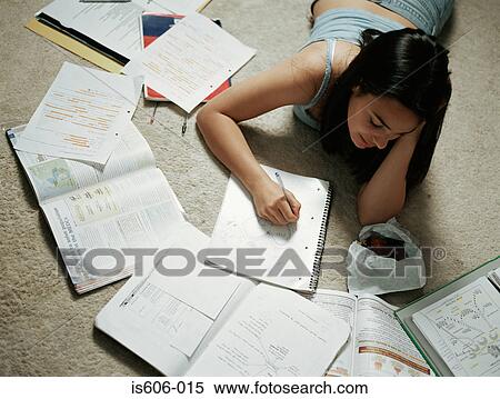 Girl doing homework on floor View Large Photo Image Stock Photography - Girl doing homework on floor. Fotosearch