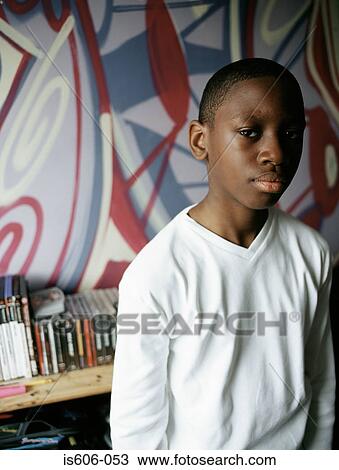 Portrait of teenage boy in bedroom View Large Photo Image Stock Image - Portrait of teenage boy in bedroom. Fotosearch