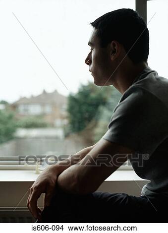 Silhouetted boy near window View Large Photo Image Picture - Silhouetted boy near window. Fotosearch