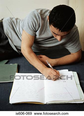 Teenage boy doing homework View Large Photo Image Stock Photo - Teenage boy doing homework. Fotosearch