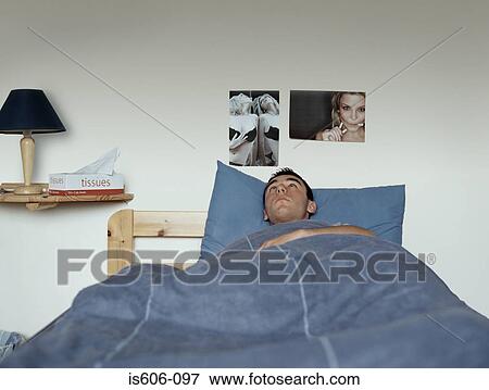 Teenage boy in bed View Large Photo Image Stock Photo - Teenage boy in bed. Fotosearch
