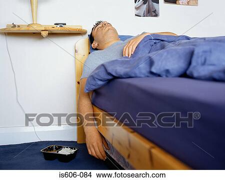 Picture - Teenage boy sleeping. Fotosearch