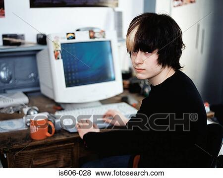 Stock Photo - Teenage boy using personal computer. Fotosearch