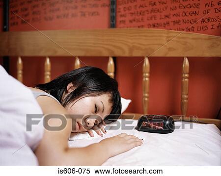 Teenage girl sleeping in bed View Large Photo Image Stock Photography - Teenage girl sleeping in bed. Fotosearch