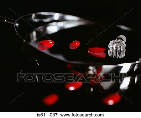 Fake fingernails and a perfume bottle top View Large Photo Image Stock Photo - Fake fingernails and a perfume bottle top. Fotosearch