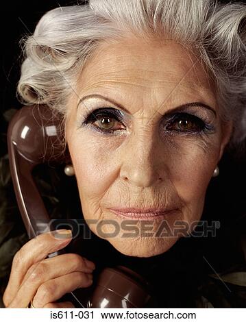 Glamourous senior woman on telephone View Large Photo Image Stock Image - Glamourous senior woman on telephone. Fotosearch