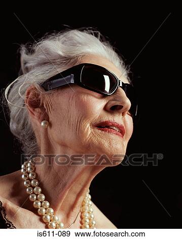 Senior woman in sunglasses View Large Photo Image Stock Photo - Senior woman in sunglasses. Fotosearch