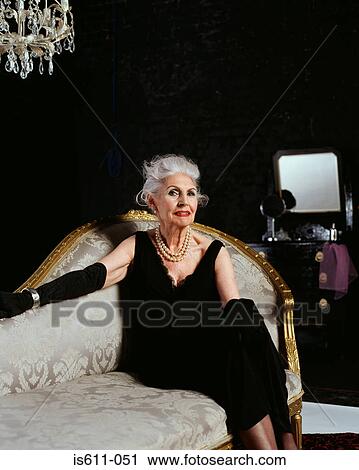 Senior woman on chaise longue View Large Photo Image Stock Image - Senior woman on chaise longue. Fotosearch