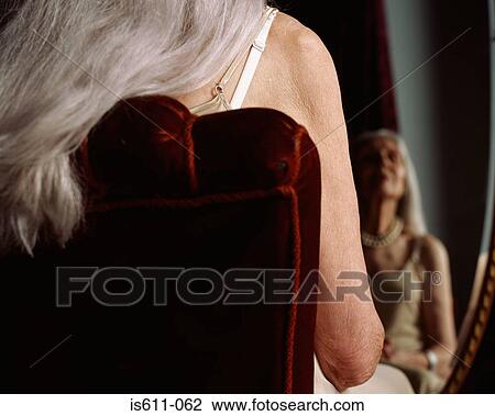 Senior woman reflected in mirror View Large Photo Image Stock Image - Senior woman reflected in mirror. Fotosearch