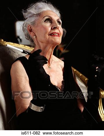 Senior woman with cigarette holder View Large Photo Image Stock Image - Senior woman with cigarette holder. Fotosearch