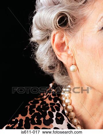 The side of a senior woman's face View Large Photo Image Stock Photo - The side of a senior woman's face . Fotosearch