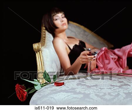 Woman with cocktail glass and rose View Large Photo Image Stock Photo - Woman with cocktail glass and rose. Fotosearch