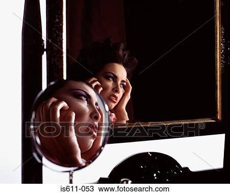 Woman's face reflected in two mirrors View Large Photo Image Stock Image - Woman's face reflected in two mirrors . Fotosearch