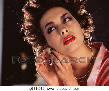 Stock Image - Young woman smelling rose . Fotosearch