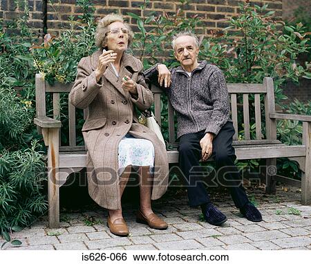 Elderly couple on a bench View Large Photo Image Stock Photograph - Elderly couple on a bench. Fotosearch
