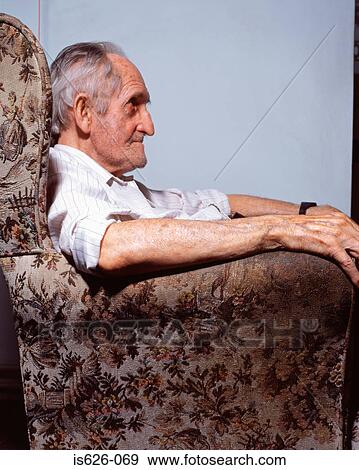 Elderly man in armchair View Large Photo Image Stock Photo - Elderly man in armchair . Fotosearch