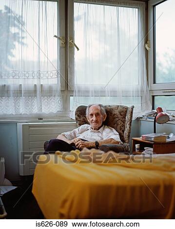 Stock Photo - Elderly man in his room. Fotosearch