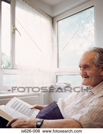 Stock Photo - Elderly man with book. Fotosearch