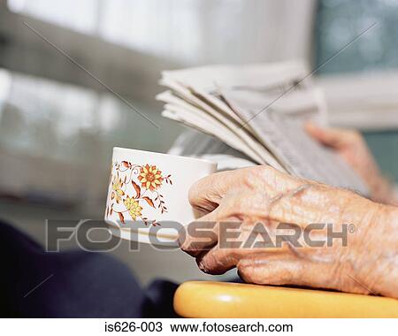 Elderly person reading the newspaper View Large Photo Image Stock Image - Elderly person reading the newspaper. Fotosearch