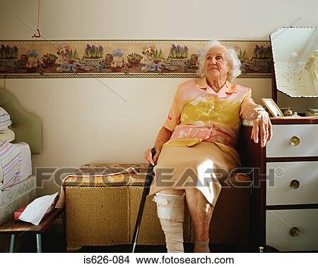 Elderly woman in her room View Large Photo Image Picture - Elderly woman in her room . Fotosearch